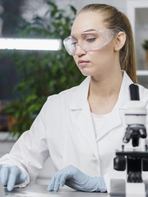 front-view-female-researcher-laboratory-with-safety-glasses-microscope Michelle Humphrey